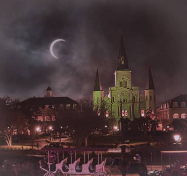 Gothic church under crescent moon, eerie sky. Illuminated building with spires, carriage in foreground. Moody and mysterious night scene.